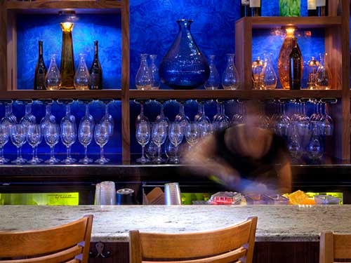 photo bar with blue venetian plaster behind the bar