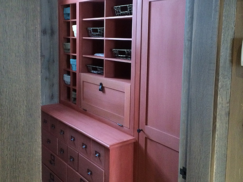 photo of cabinets with rust colored milk paint finish