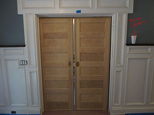 photo of oak pocket doors after removal of lead paint