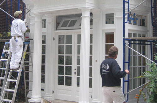 Detail of Entrance showing columns and multi-paned enclosure, transom, and doors