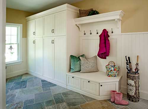 photo of mudroom with white cabinets