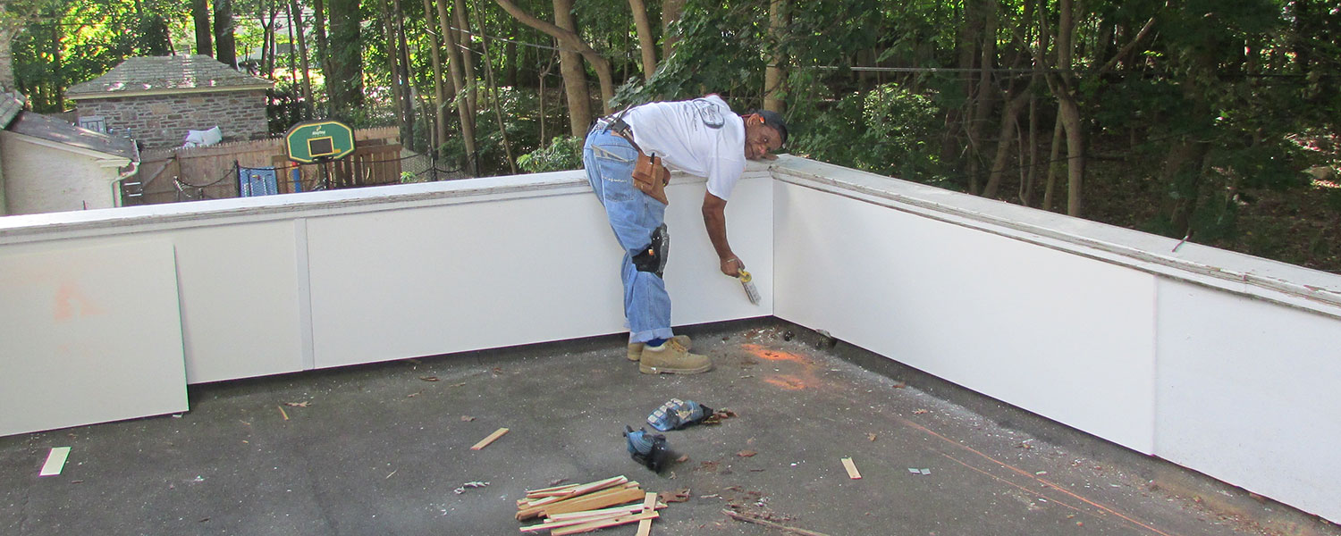 photo of damage to outside wall around balcony