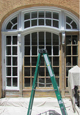 photo of palladium windows in process of having lead paint removed and being restored