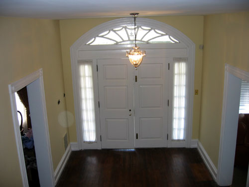 Grand foyer showing doors with detailed window arch