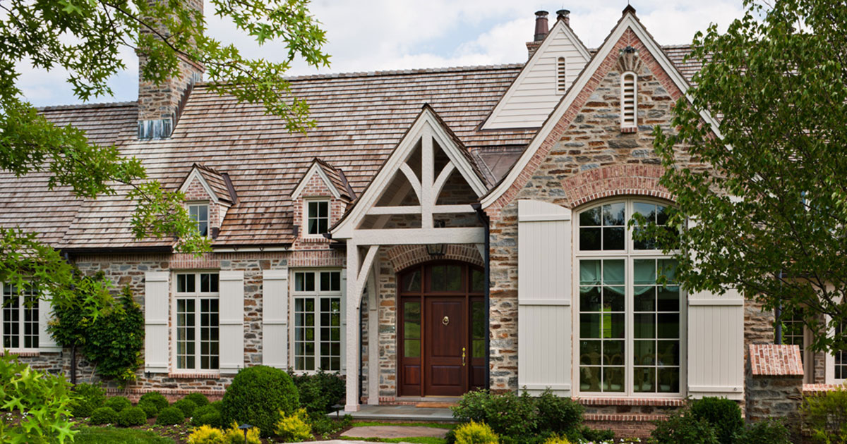 photo of exterior of house with special finishes on door, posts, shutters and windows